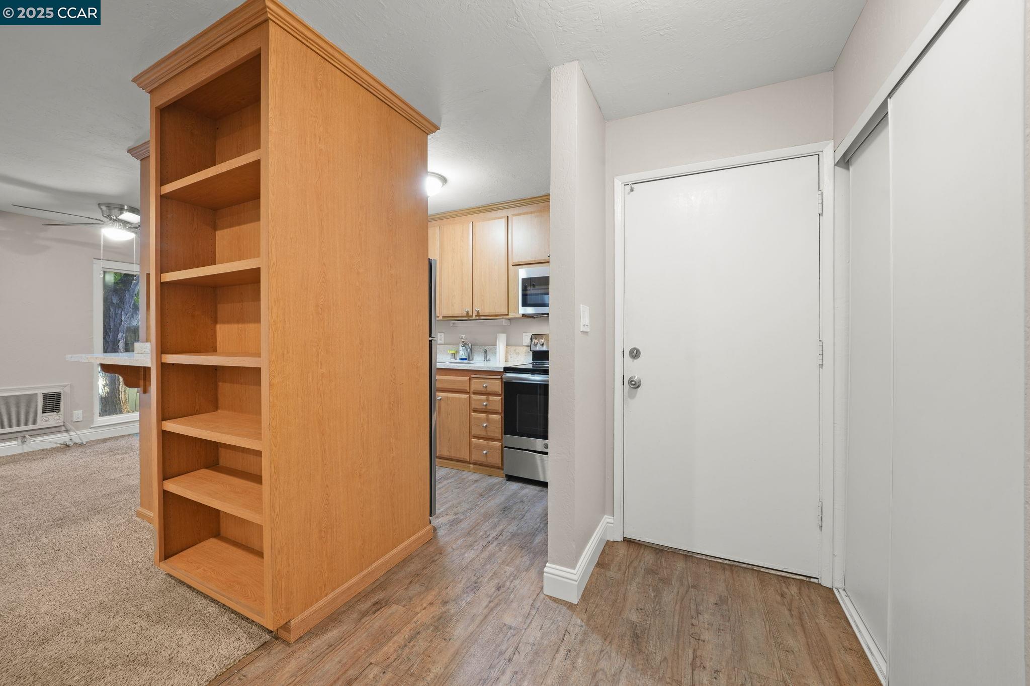 1036 Oak Grove Road, Unit 21 Concord, CA 94518 - Photo 10 of 23 a view of hallway with wooden floor