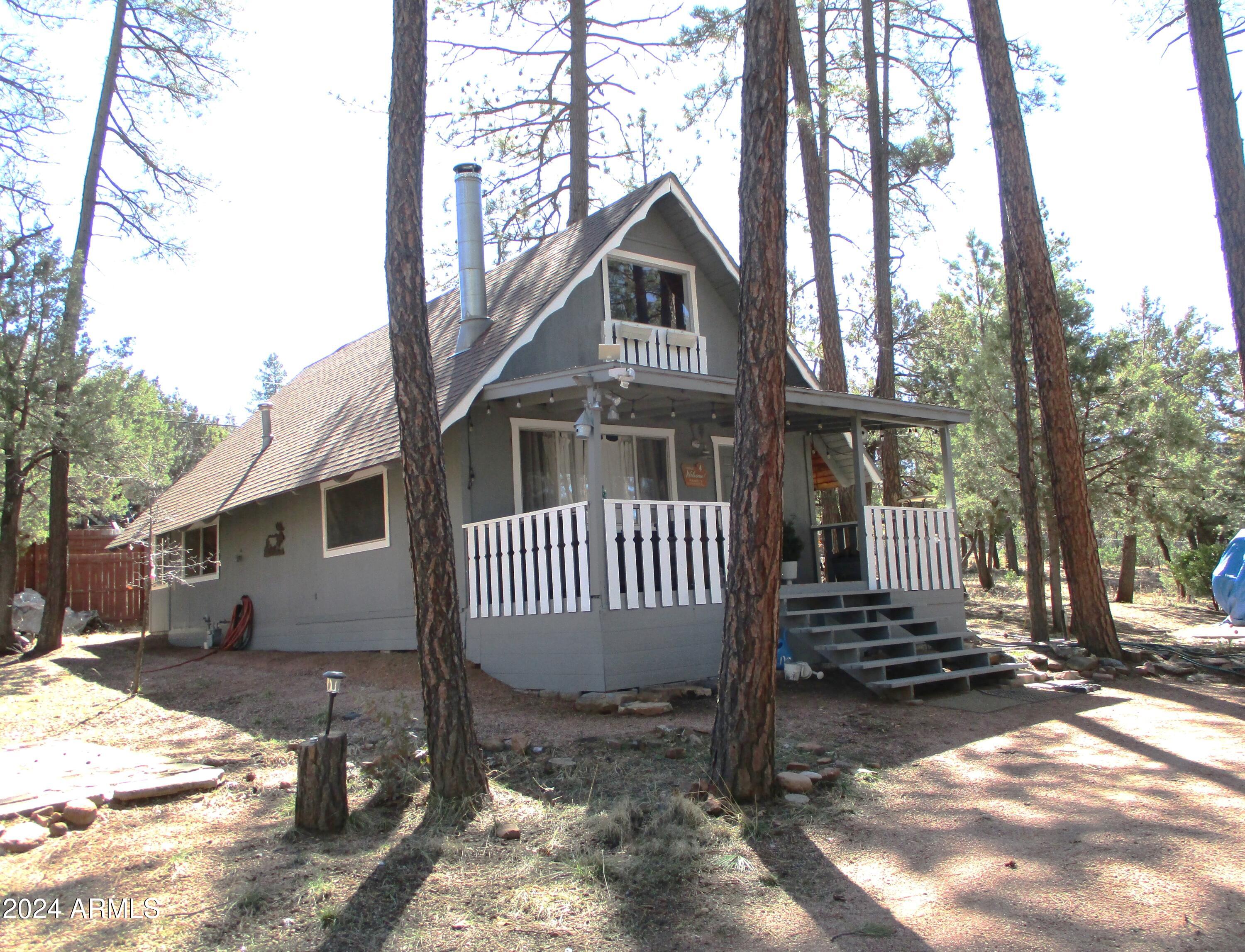 8539 Buffalo Road Strawberry, AZ 85544 - Photo 1 of 19 a front view of a house with a yard