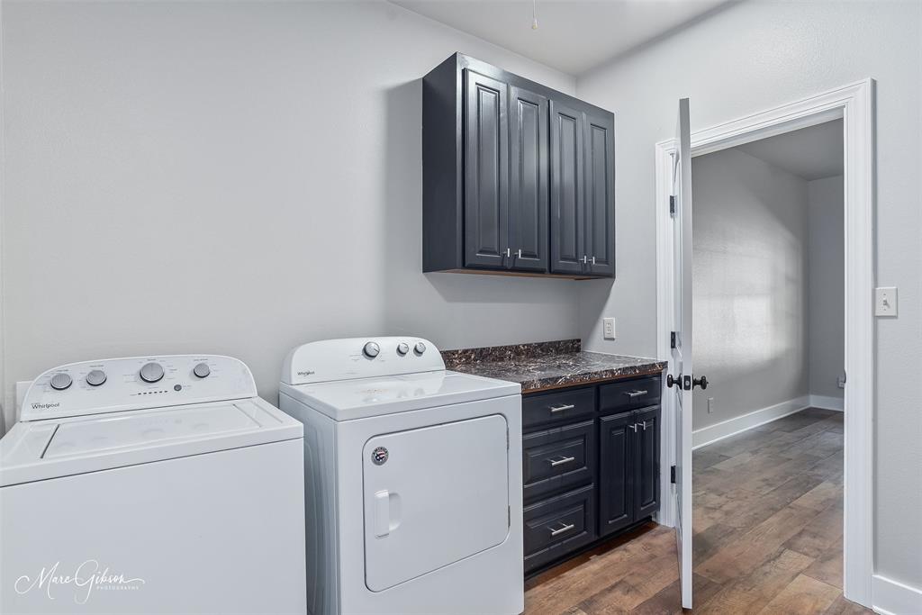 550 Linton Bellevue Road Benton, LA 71006 - Photo 22 of 37 Pass through laundry room with wood laminate flooring, cabinet space, and separate washer and dryer