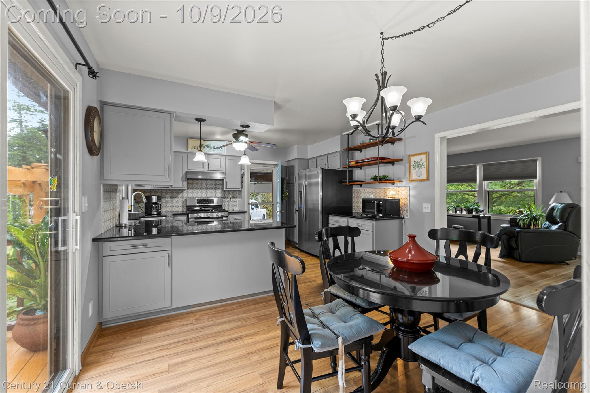 43040 Willis Road Belleville, MI 48111 - Photo 14 of 65 Kitchen featuring light gray cabinetry, dark countertops, a patterned tile backsplash, stainless steel appliances, and wood-finish flooring