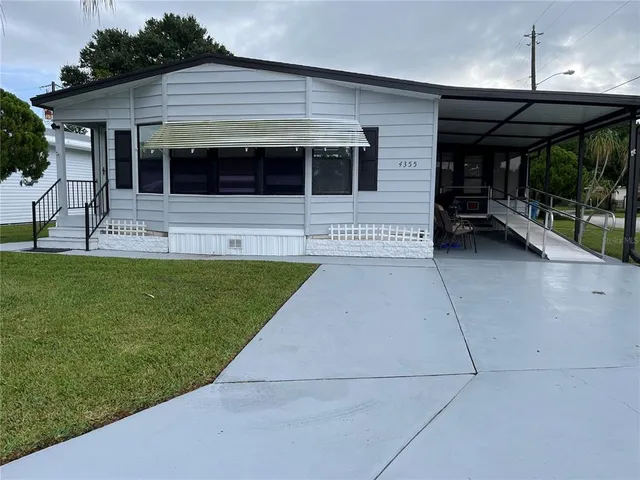 a view of house with yard