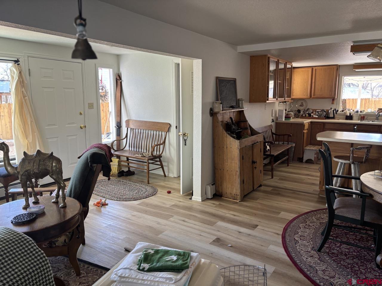 180 Northwest 4th Street Cedaredge, CO 81413 - Photo 11 of 17 a living room with furniture and a wooden floor