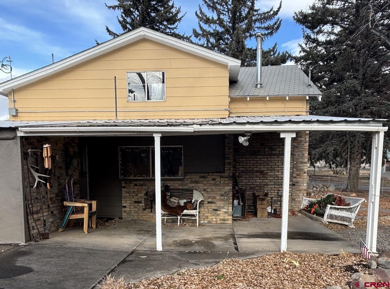 180 Northwest 4th Street Cedaredge, CO 81413 - Photo 3 of 17 a view of a front door with outdoor seating
