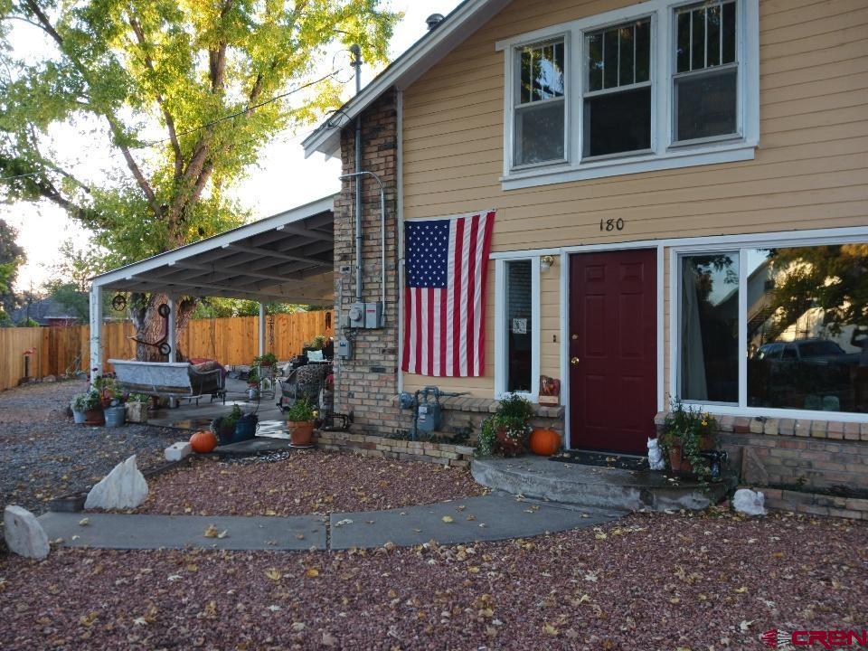 180 Northwest 4th Street Cedaredge, CO 81413 - Photo 4 of 17 a view of a house with backyard porch and sitting area