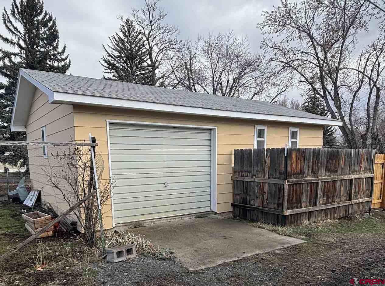 180 Northwest 4th Street Cedaredge, CO 81413 - Photo 6 of 17 a view of a small house with a outdoor space