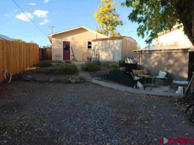 180 Northwest 4th Street Cedaredge, CO 81413 - Photo 8 of 17 a view of a house with backyard and sitting area
