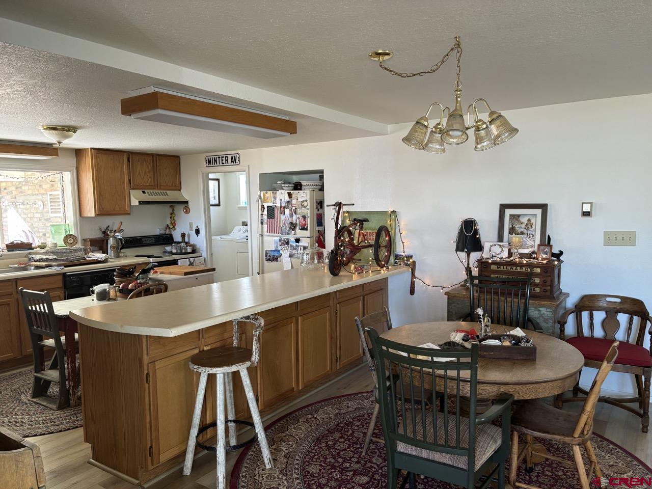 180 Northwest 4th Street Cedaredge, CO 81413 - Photo 10 of 17 a kitchen with a dining table and chairs