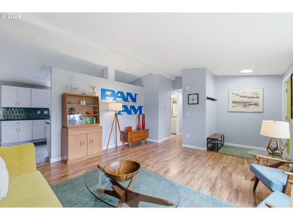a living room with furniture window and a flat screen tv