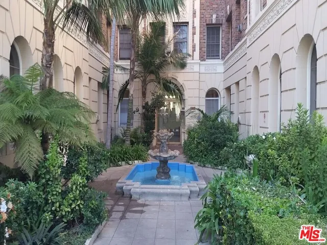 a view of a building with garden and plants