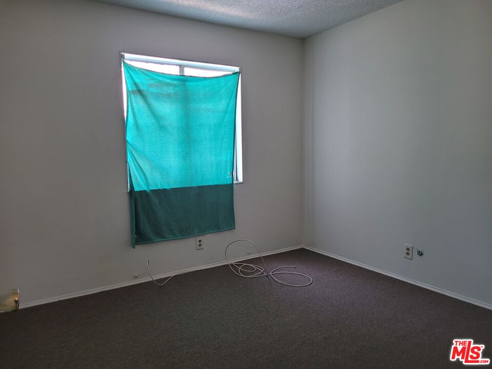 7 Scottsdale Drive Carson, CA 90745 - Photo 6 of 13 an empty room with a window