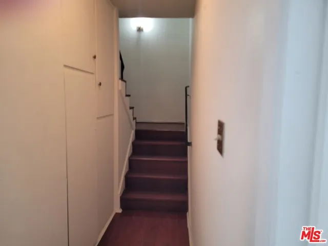 a view of a hallway with stairs