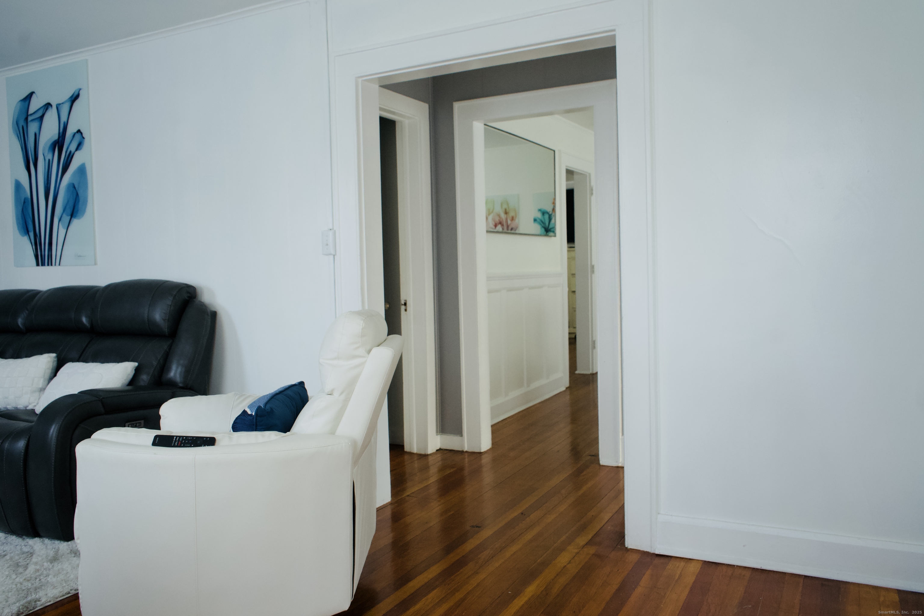 533 Clinton Avenue Bridgeport, CT 06605 - Photo 13 of 18 a view of hallway with furniture and wooden floor