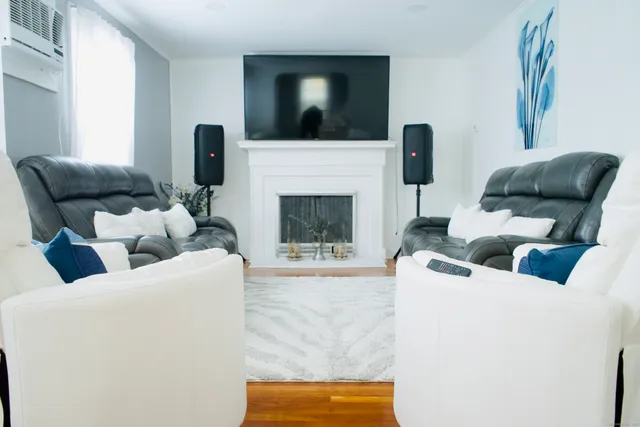 a living room with furniture and a fireplace