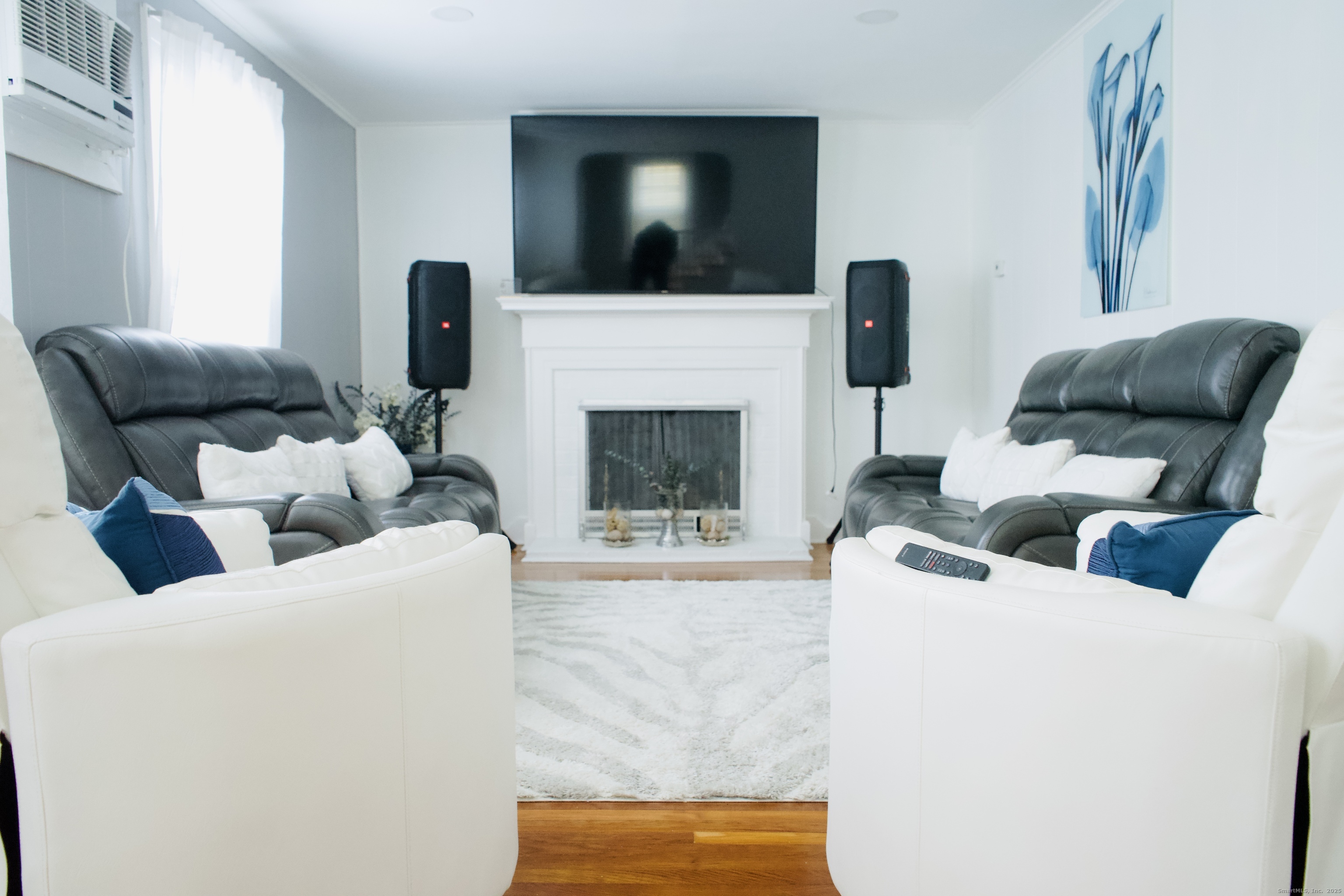 533 Clinton Avenue Bridgeport, CT 06605 - Photo 14 of 18 a living room with furniture and a fireplace