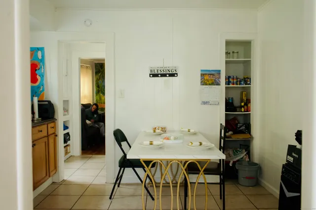a kitchen with a sink cabinets and a window