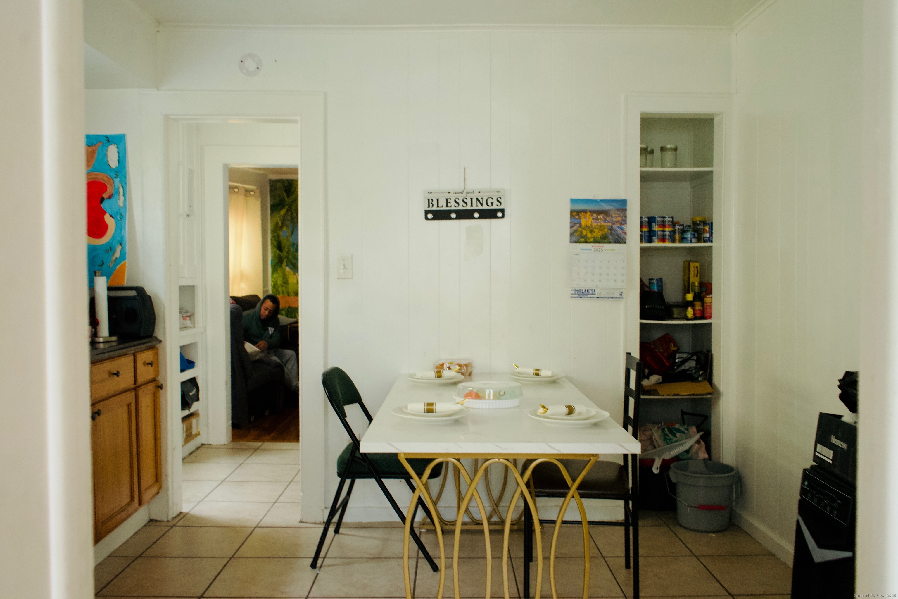 533 Clinton Avenue Bridgeport, CT 06605 - Photo 17 of 18 a view of a dining room with furniture and wooden floor