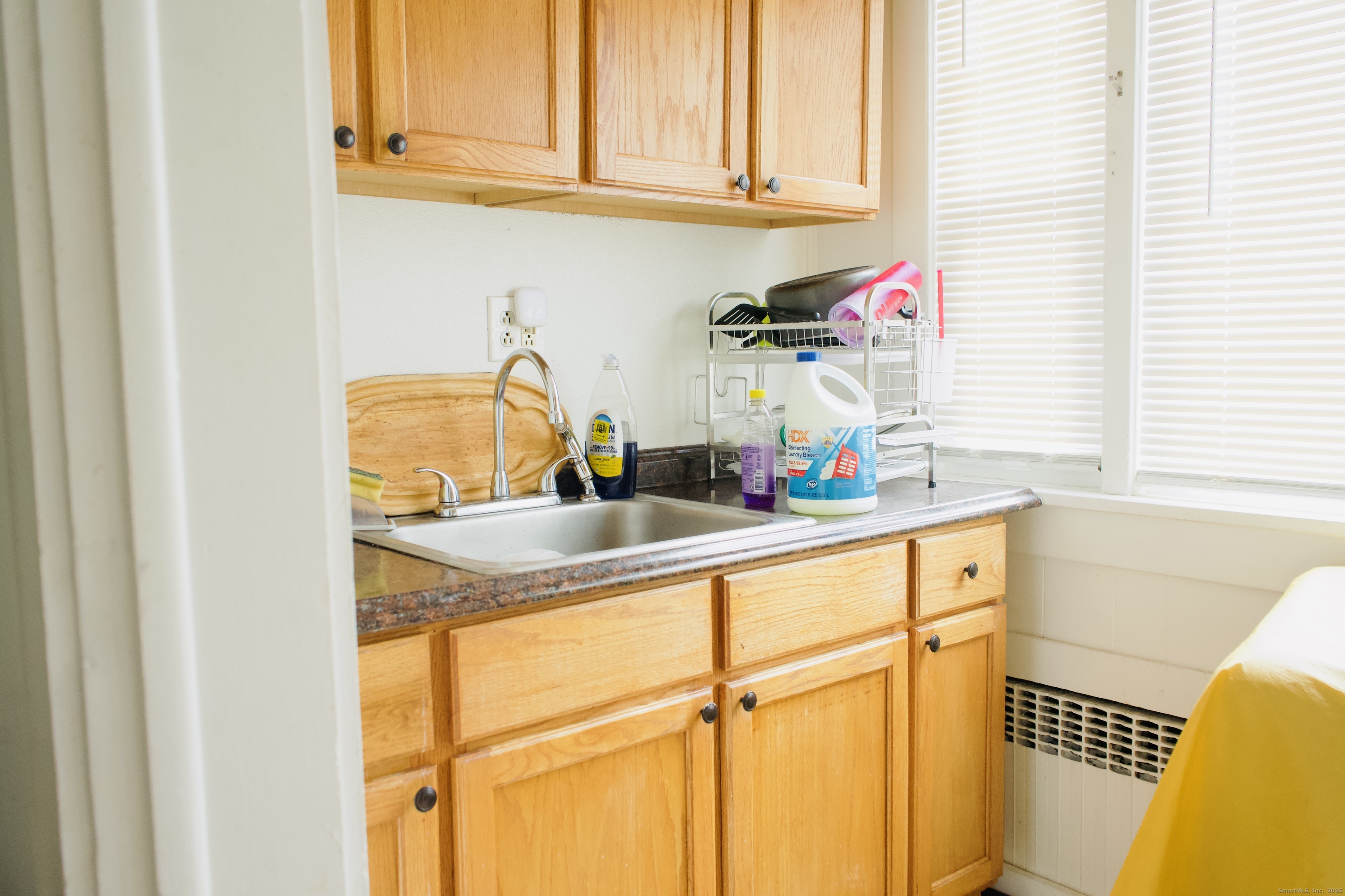 533 Clinton Avenue Bridgeport, CT 06605 - Photo 18 of 18 a kitchen with a sink cabinets and a window