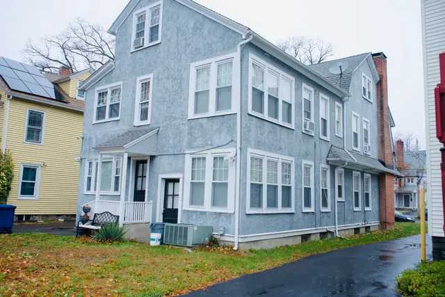 a view of a building with a yard