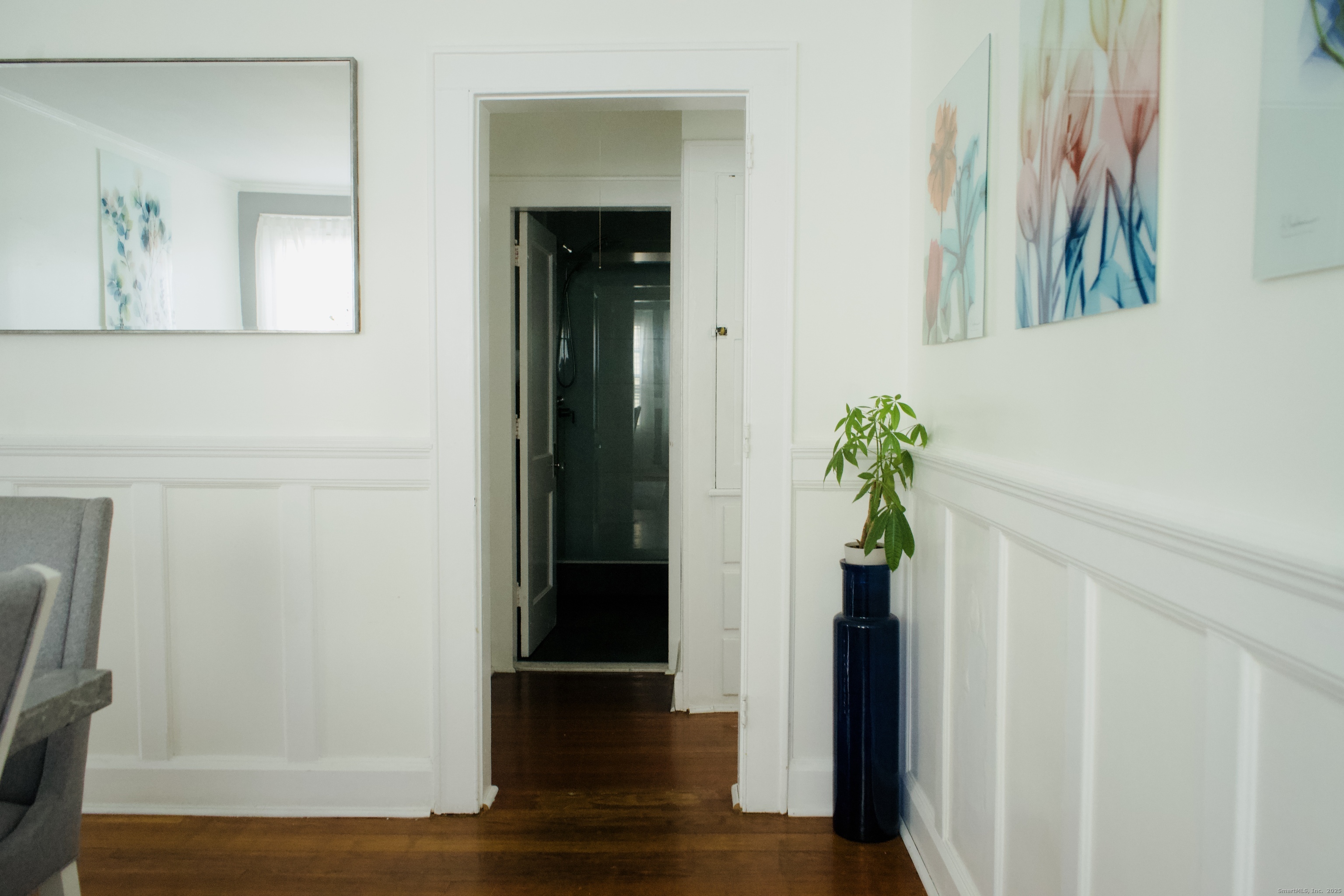 533 Clinton Avenue Bridgeport, CT 06605 - Photo 9 of 18 a view of a hallway with wooden floor and glass door