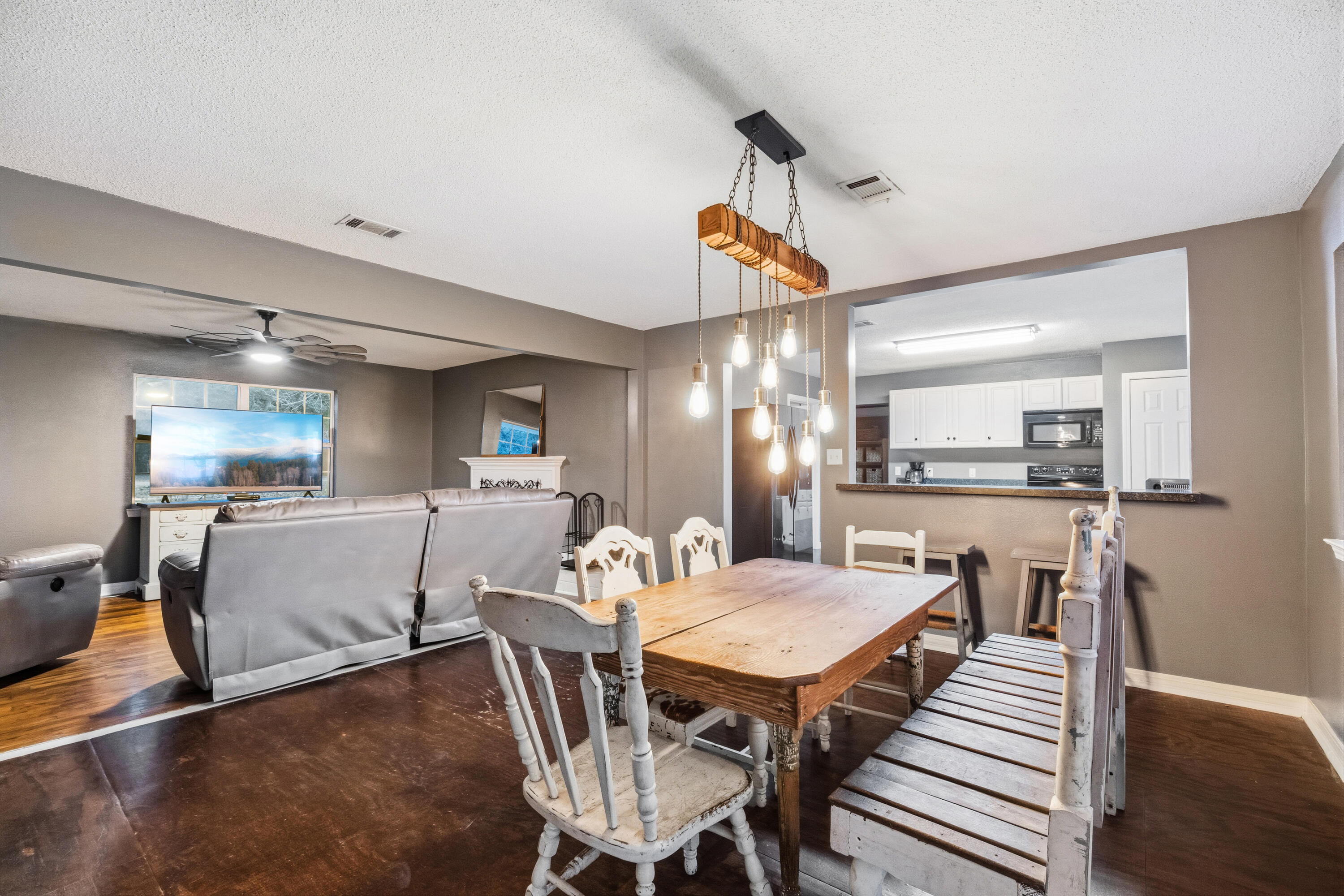4398 Cooper Lane Holt, FL 32564 - Photo 11 of 53 a view of a dining room with furniture and wooden floor