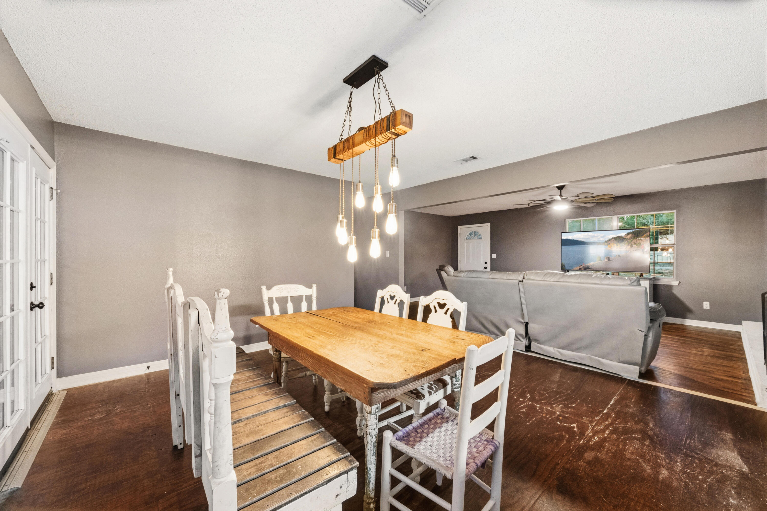 4398 Cooper Lane Holt, FL 32564 - Photo 12 of 53 a view of a dining room with furniture and wooden floor