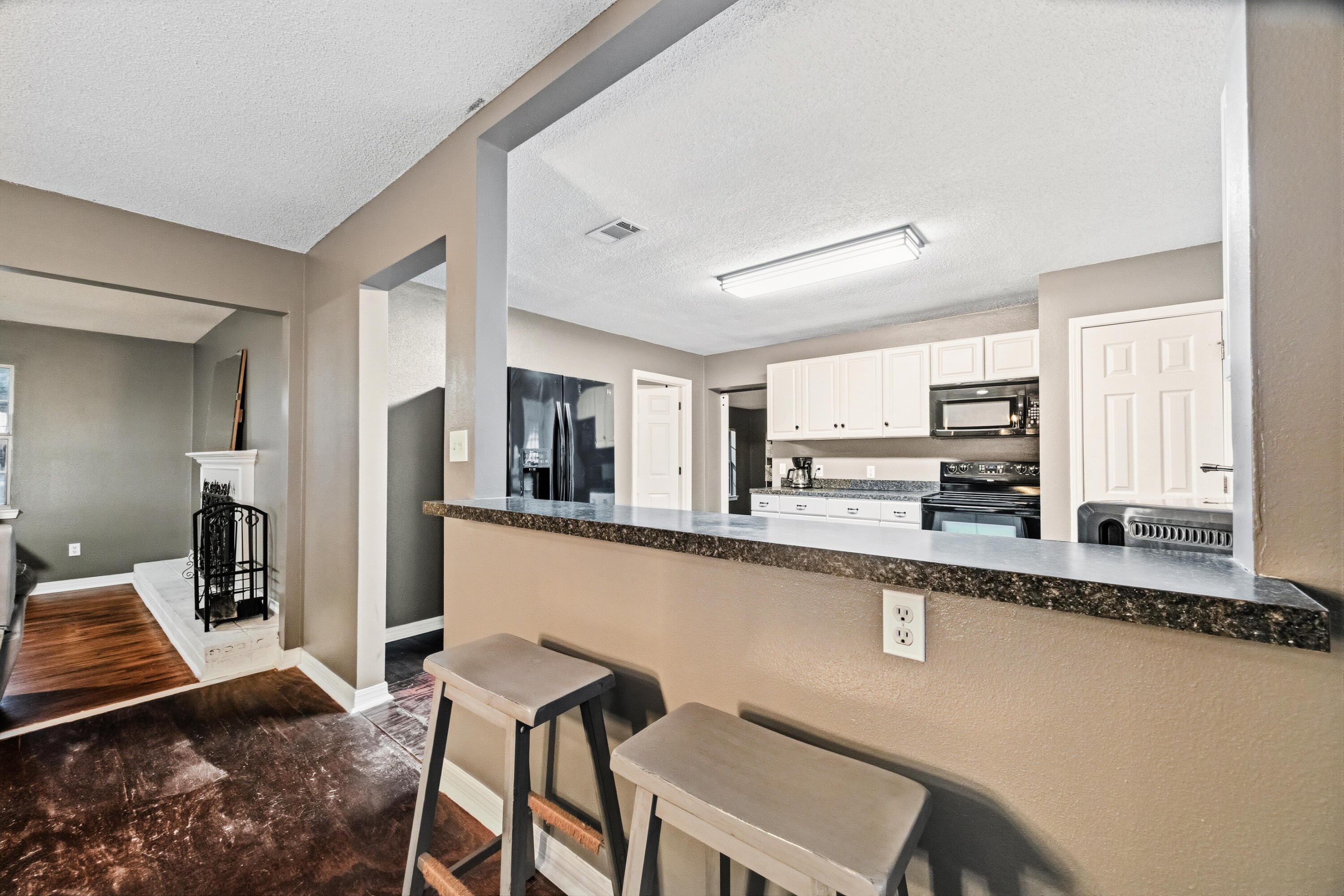 4398 Cooper Lane Holt, FL 32564 - Photo 13 of 53 a large kitchen with granite countertop lots of counter top space and cabinets
