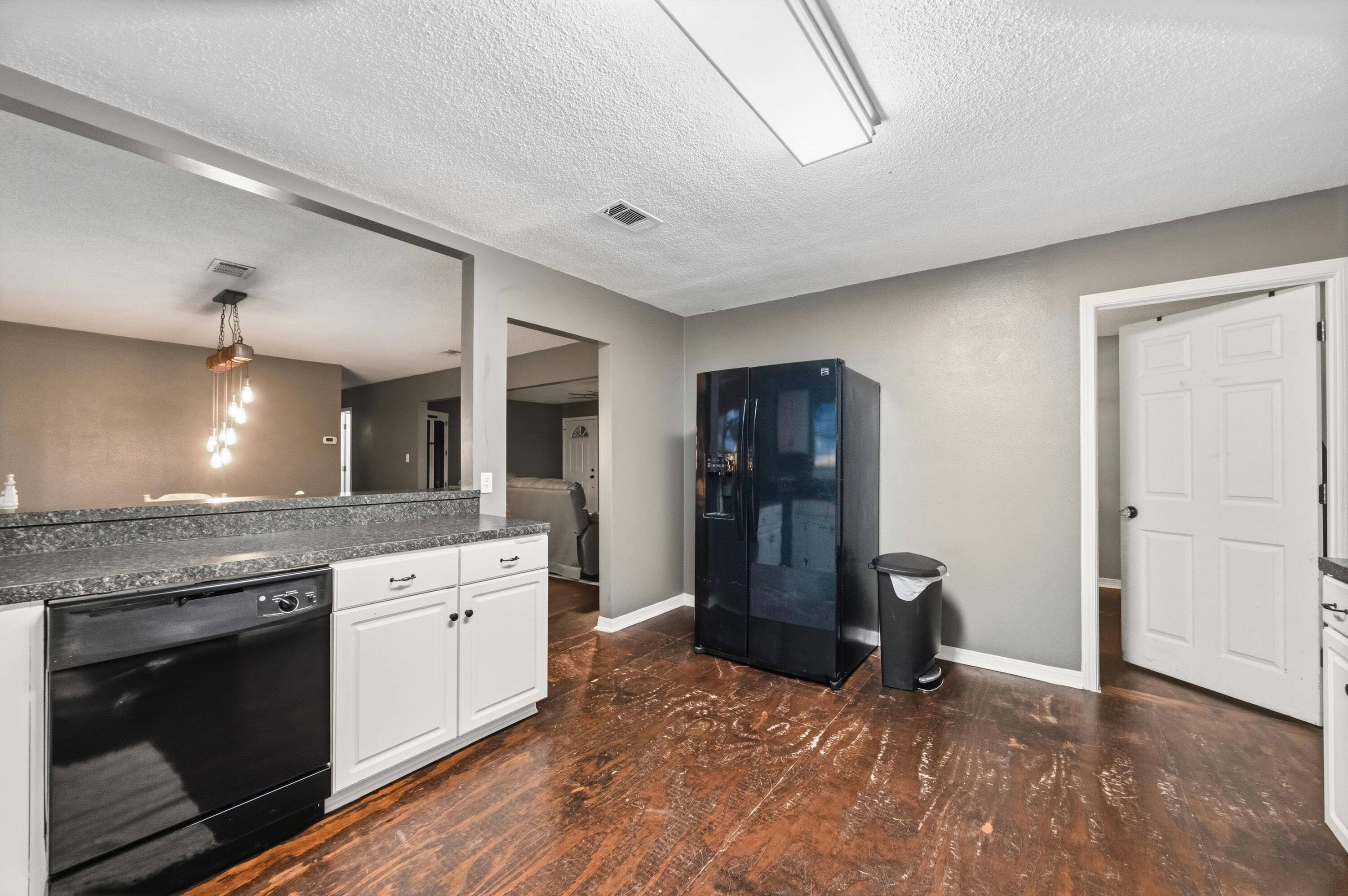 4398 Cooper Lane Holt, FL 32564 - Photo 17 of 53 a kitchen with stainless steel appliances granite countertop a refrigerator a stove and a sink