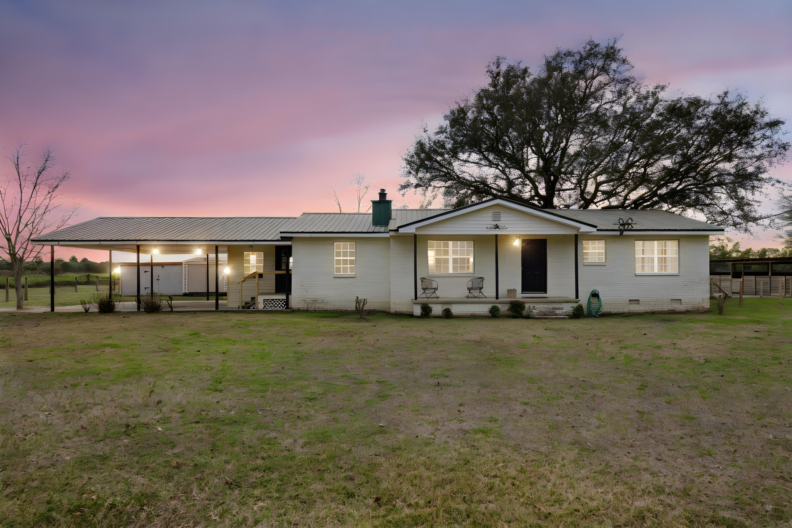 4398 Cooper Lane Holt, FL 32564 - Photo 2 of 53 a front view of a house with a garden and porch