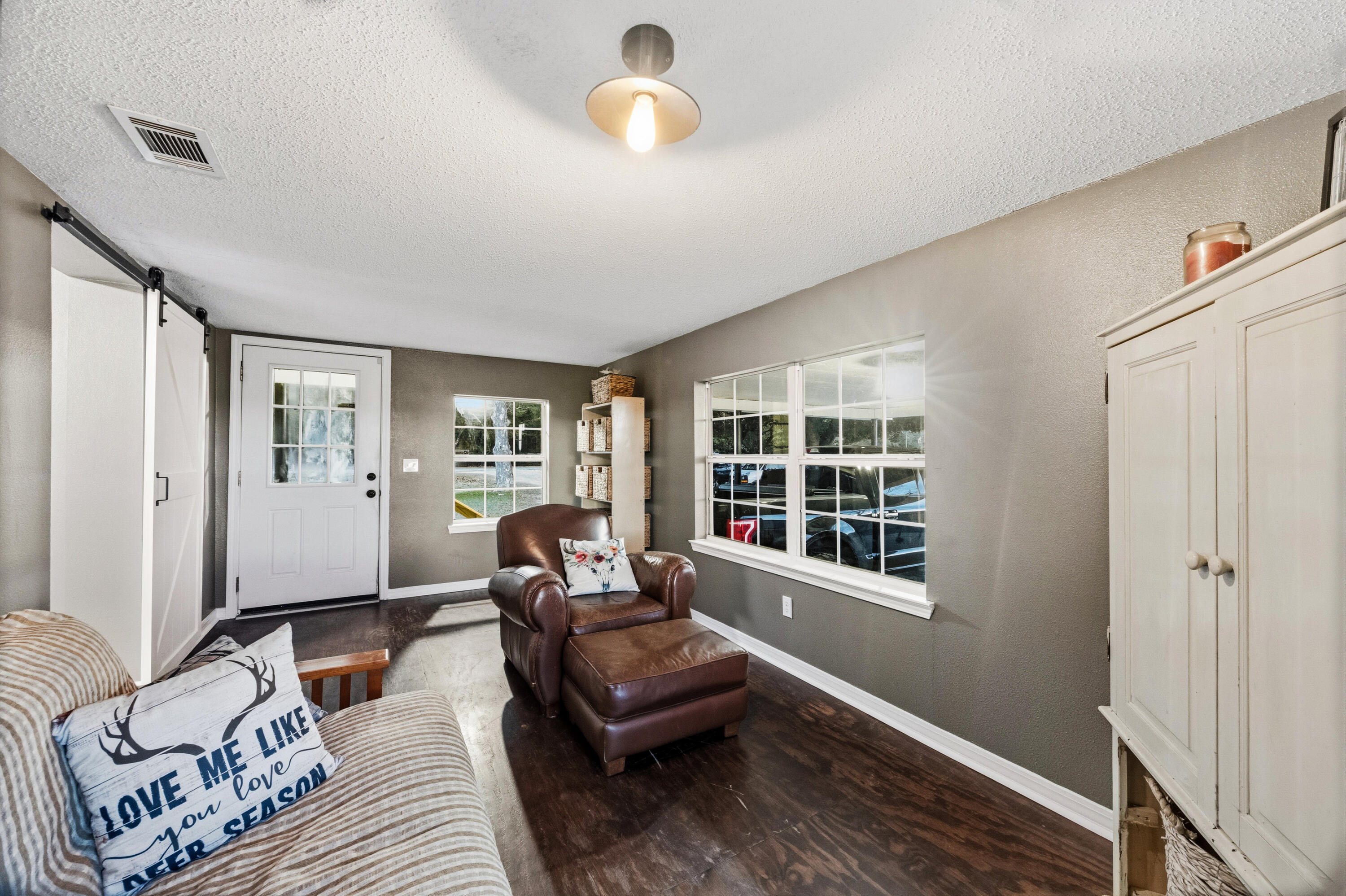 4398 Cooper Lane Holt, FL 32564 - Photo 23 of 53 a living room with furniture and a window