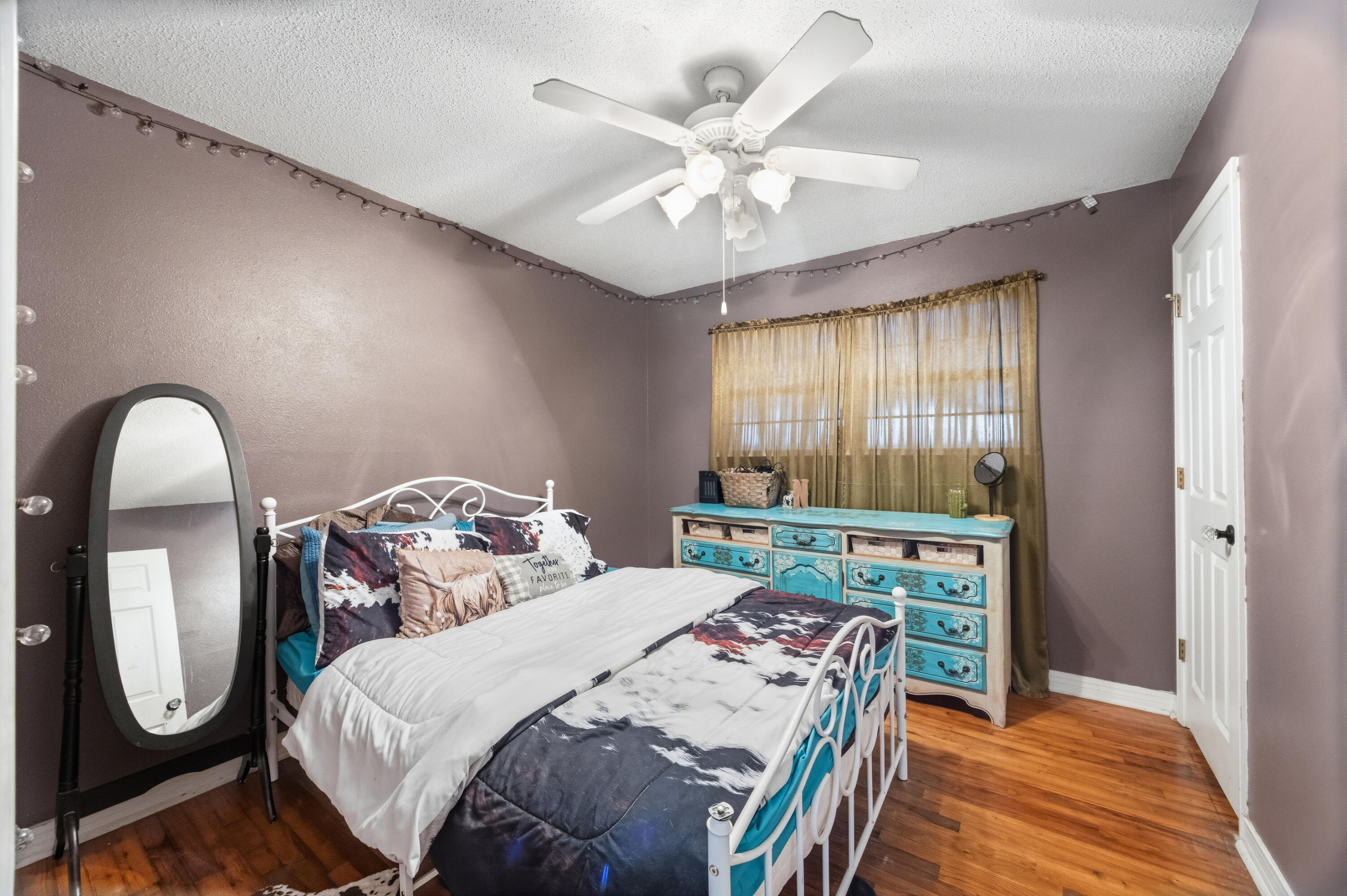 4398 Cooper Lane Holt, FL 32564 - Photo 30 of 53 a bedroom with a bed mirror and window