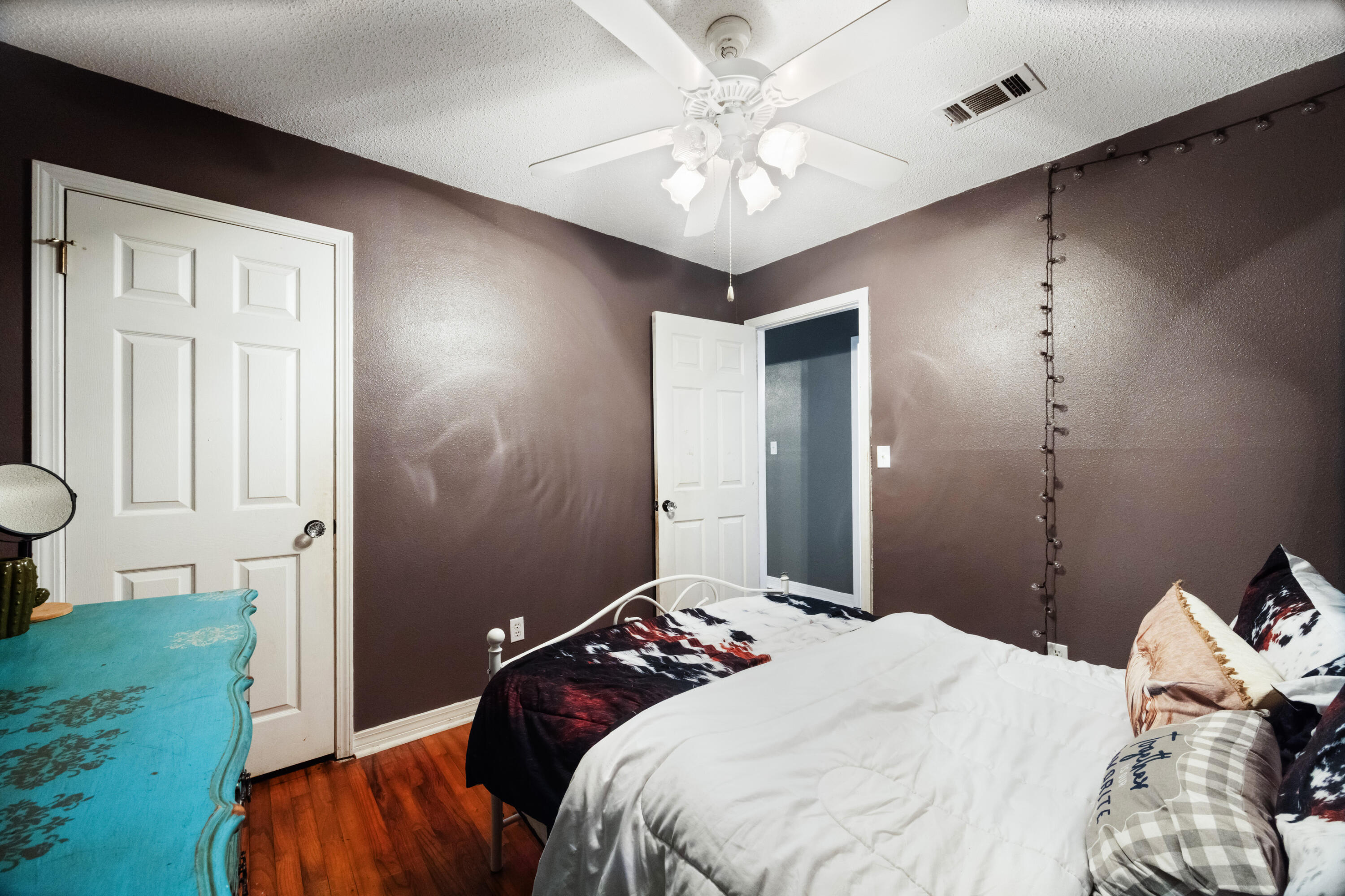 4398 Cooper Lane Holt, FL 32564 - Photo 31 of 53 a bedroom with a bed and a chandelier