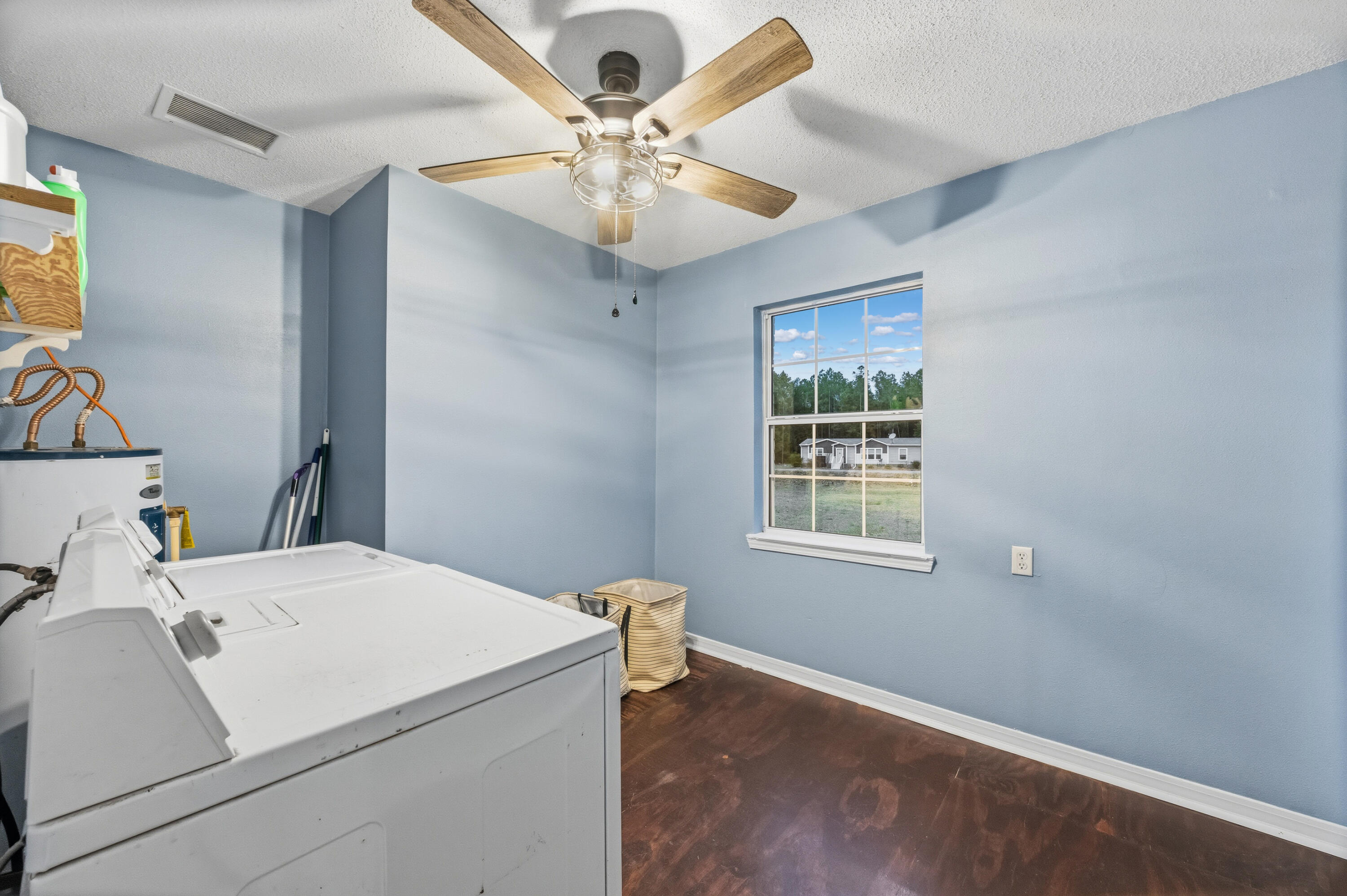 4398 Cooper Lane Holt, FL 32564 - Photo 34 of 53 a room that has a bed and a window