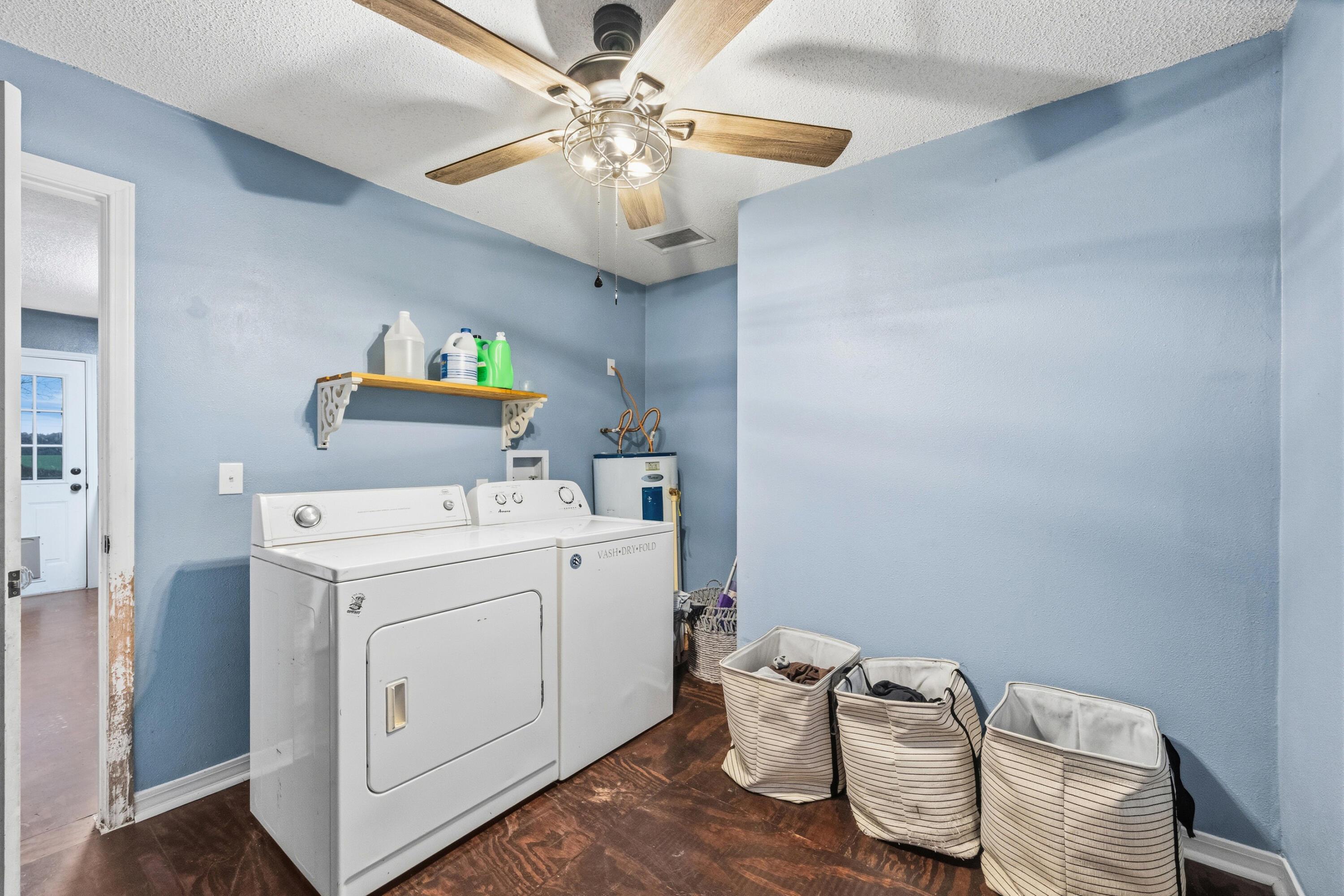 4398 Cooper Lane Holt, FL 32564 - Photo 35 of 53 a view of washer and dryer with kitchen chandelier