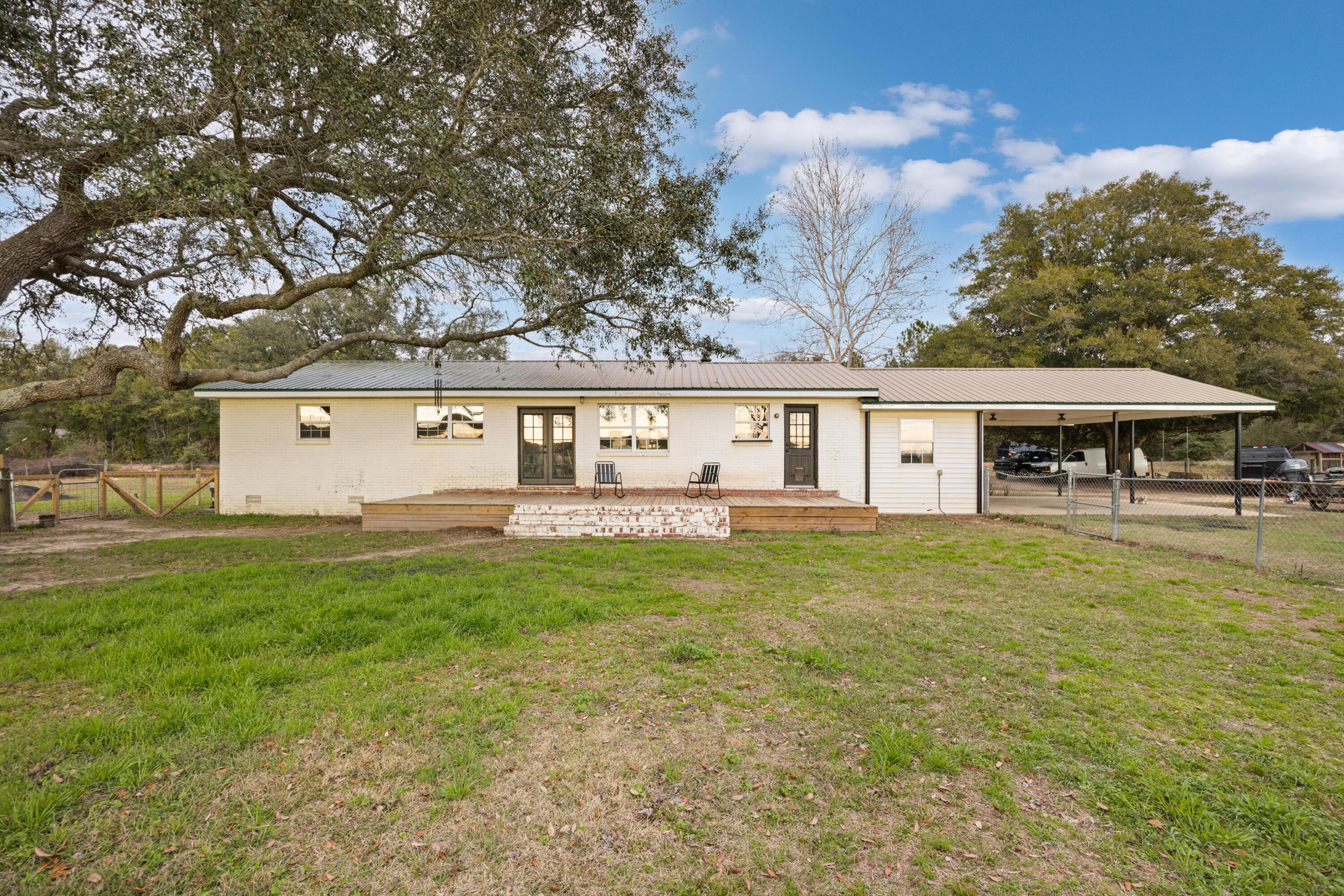 4398 Cooper Lane Holt, FL 32564 - Photo 37 of 53 front view of a house with a yard