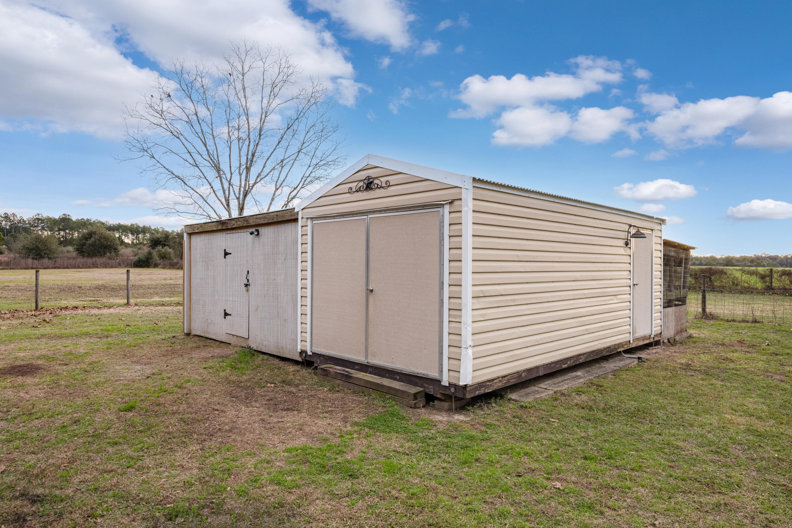 4398 Cooper Lane Holt, FL 32564 - Photo 40 of 53 a view of a backyard with pathway