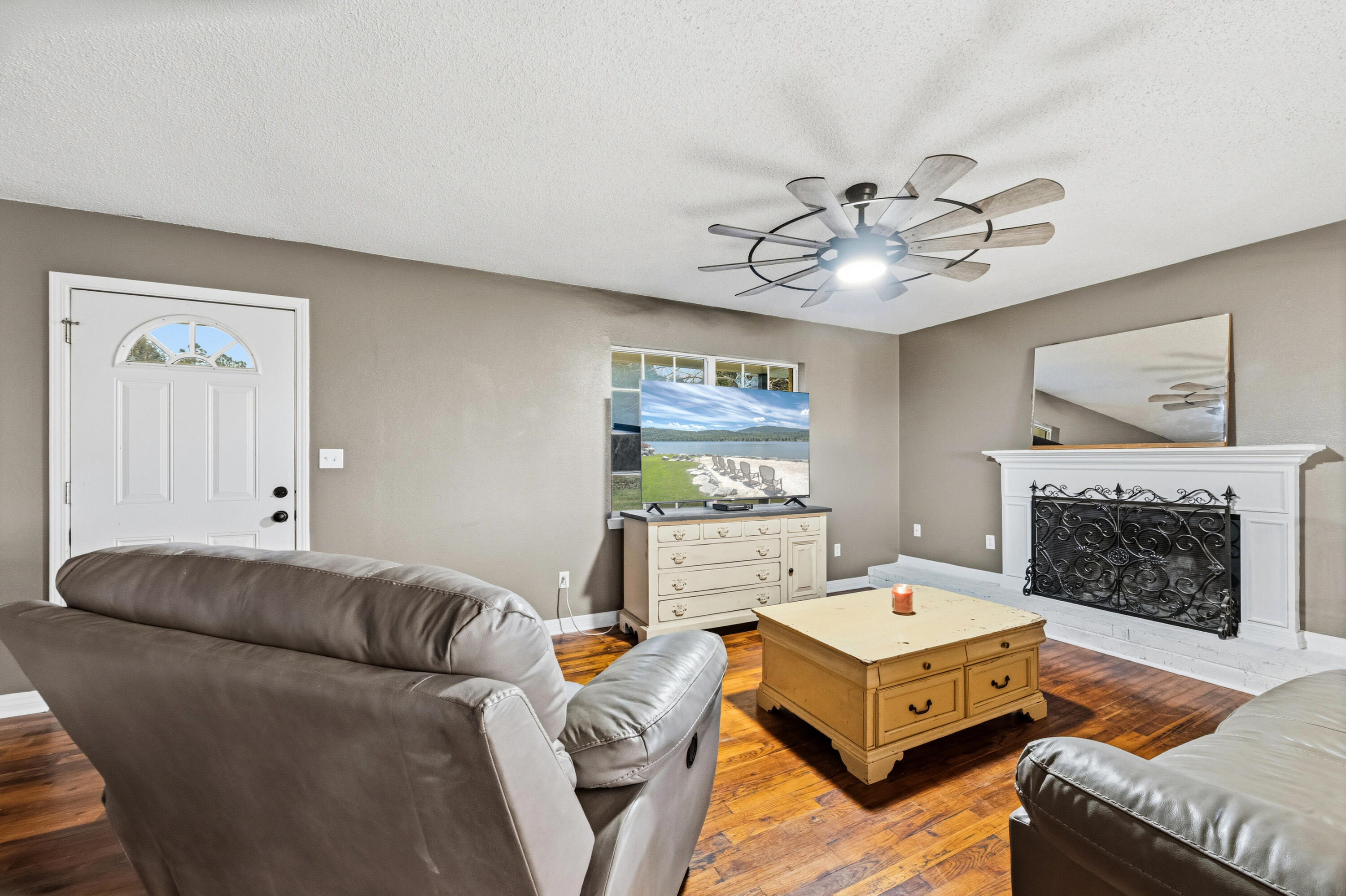 4398 Cooper Lane Holt, FL 32564 - Photo 6 of 53 a living room with furniture and a fireplace