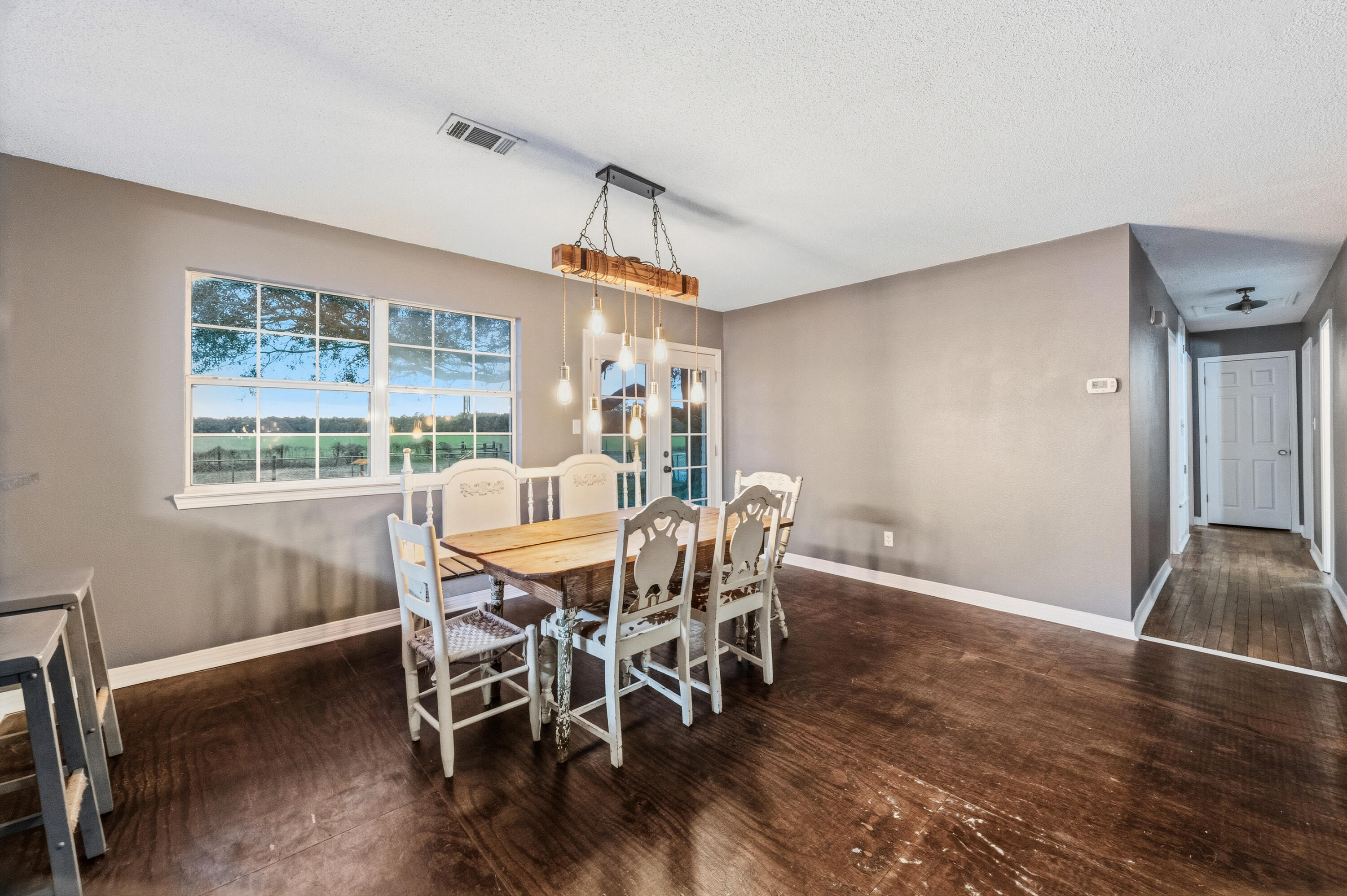 4398 Cooper Lane Holt, FL 32564 - Photo 9 of 53 a view of a dining room with furniture window and outside view