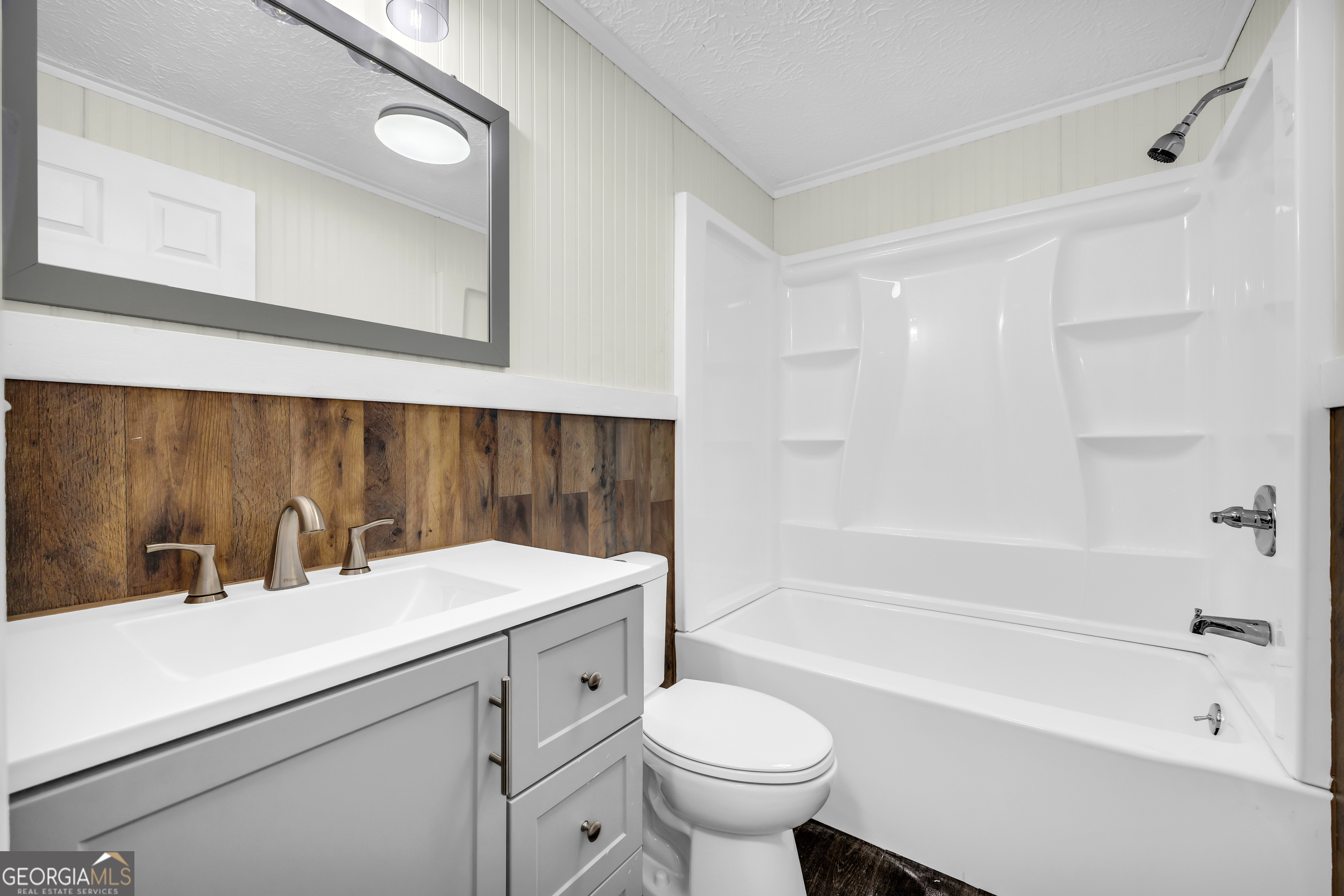 5620 Mize Road Toccoa, GA 30577 - Photo 15 of 37 a bathroom with a sink a toilet and a bathtub