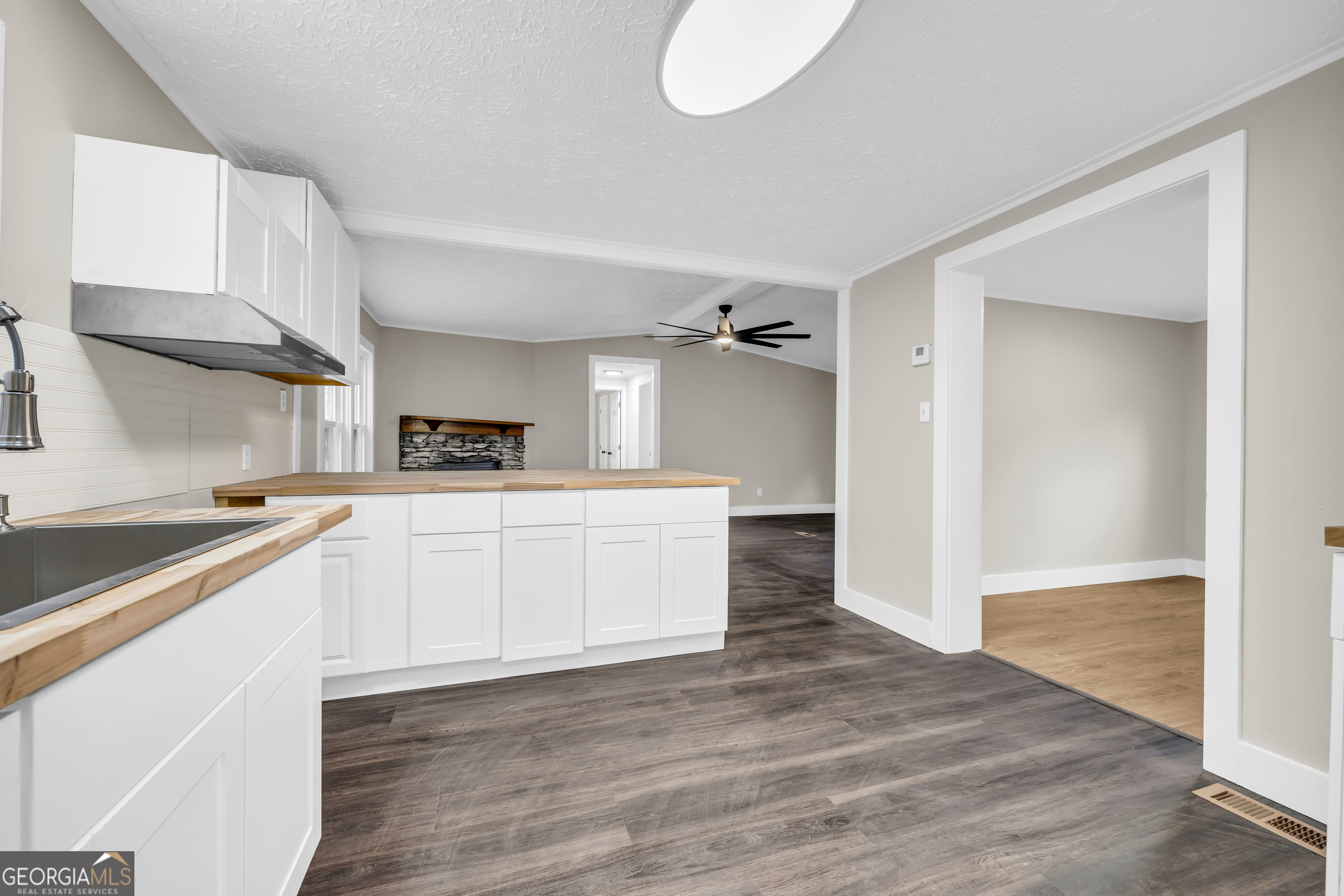 5620 Mize Road Toccoa, GA 30577 - Photo 22 of 37 a kitchen with white cabinets and white appliances