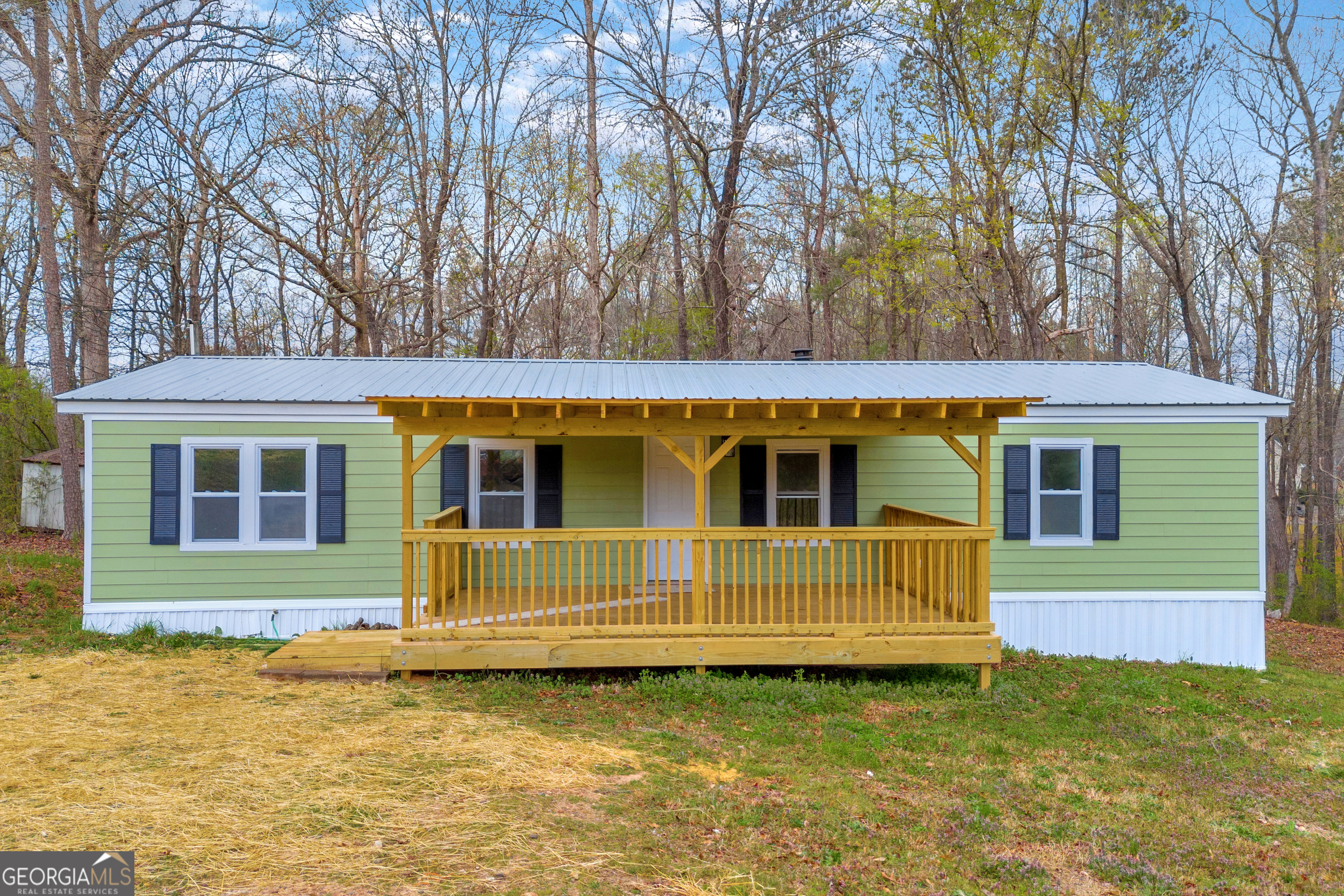 5620 Mize Road Toccoa, GA 30577 - Photo 3 of 37 a front view of a house with a garden