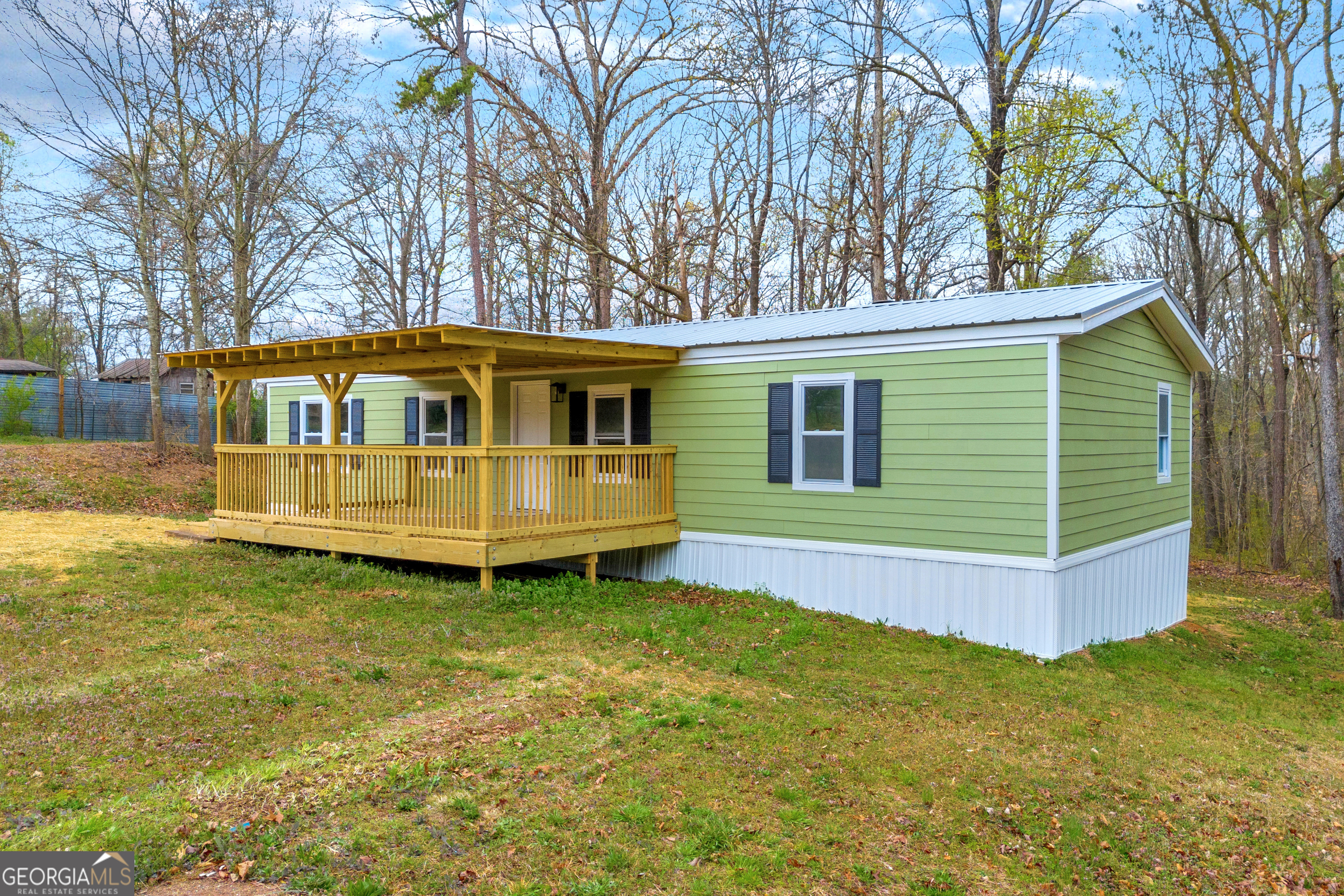 5620 Mize Road Toccoa, GA 30577 - Photo 4 of 37 a front view of a house with a garden