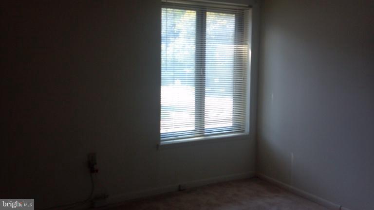 10547 Twin Rivers Road, Unit C1 Columbia, MD 21044 - Photo 4 of 6 a view of an empty room with a window