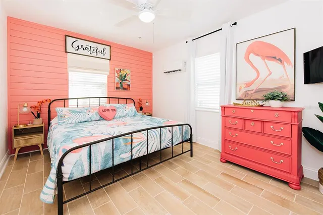 a bedroom with a bed and a dresser