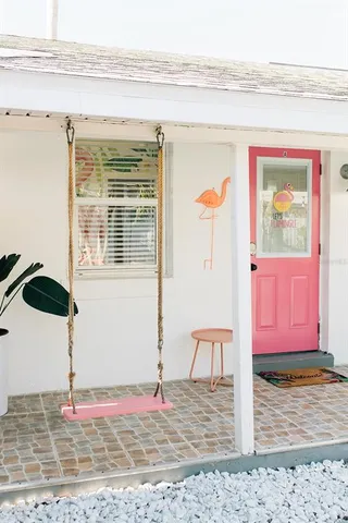 a view of a livingroom with furniture and staircase
