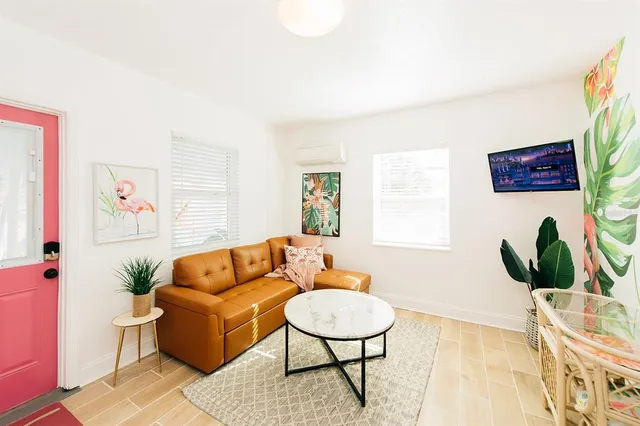 a living room with furniture and a rug