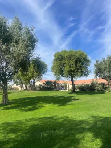 a view of a swimming pool with an outdoor seating