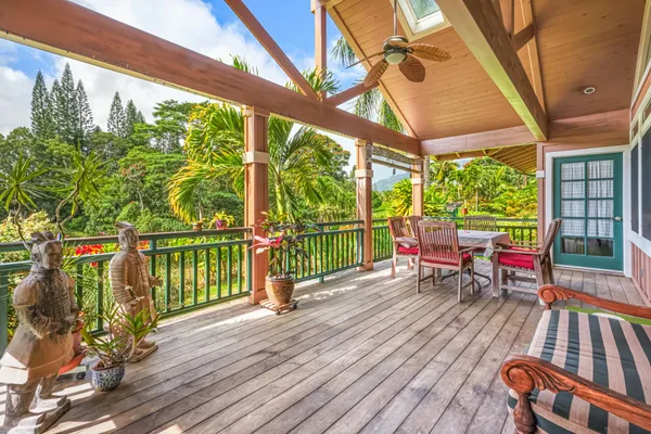 a house with wooden floor and outdoor seating