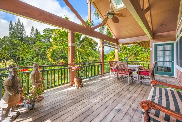 a house with wooden floor and outdoor seating