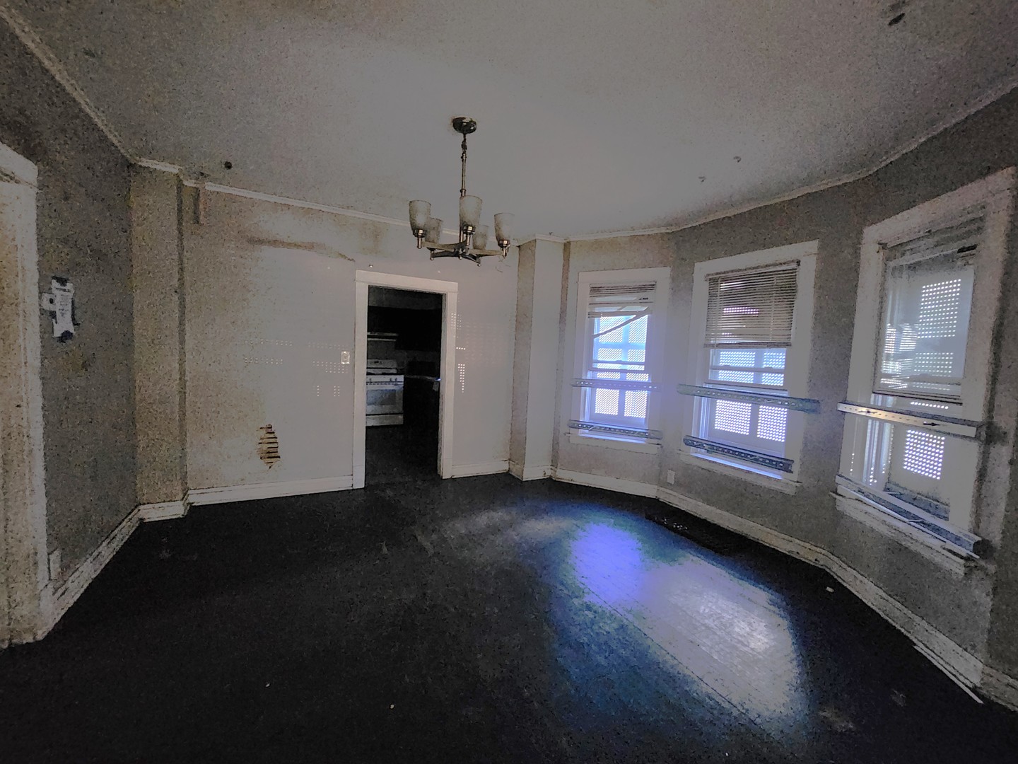 310 West 108th Place Chicago, IL 60628 - Photo 6 of 12 wooden floor in an empty room with a window