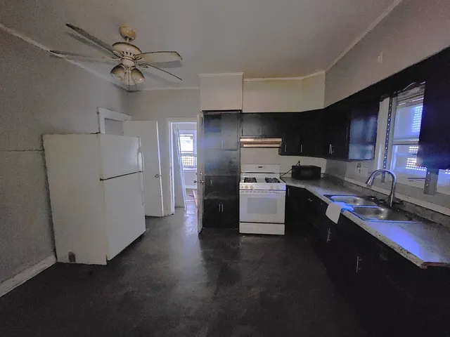 a kitchen with a refrigerator a sink and dishwasher